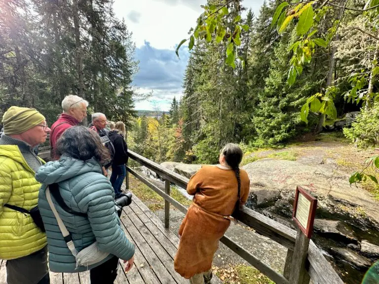 Guide by the rock carvings of Glösa. Photo: Anne Adsten